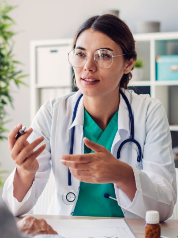 Doctor with dark hair, glasses and stetoskop